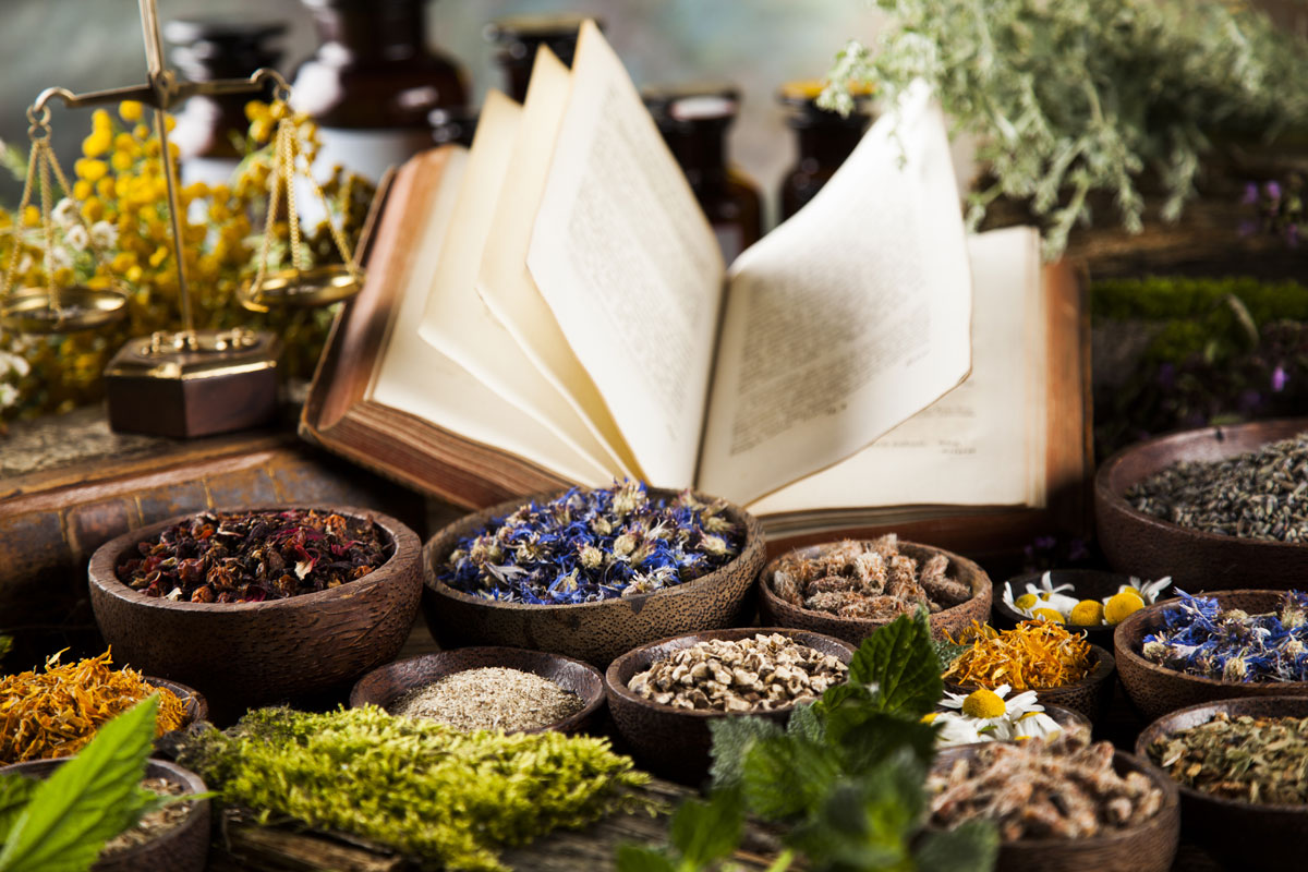 Book and Herbal medicine on wooden table background - My Approach